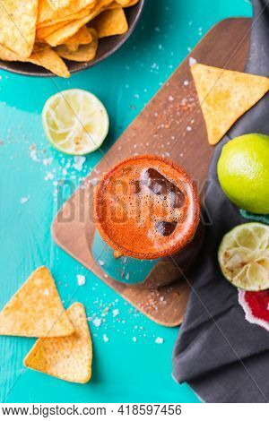 Mexican Alcohol Cocktail Michelada With Dark Beer And Lime Juice
