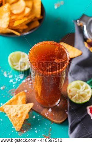 Mexican Alcohol Cocktail Michelada With Dark Beer And Lime Juice