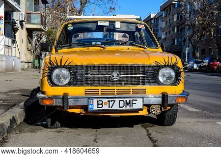 Bucharest, Romania, 1 January 2021 Old Yellow Skoda Car From Checz Republic, Decorated On A Street I