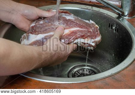 Homemade Capicola (coppa). Dry-cured Pork Loin Step-by-step Recipe. Man Washes Salt Off A Piece Of P