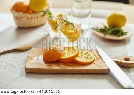 Citrus And Rosemary Fresh Lemonade In Glass On A White Table At Home