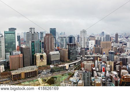 Osaka, Japan - 18 May, 2015: View From Above On Osaka City With Skyline With Skycrapers, Highways An