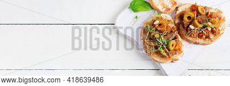 Traditional Italian Caponata And Toast On A Wooden White Table. Sicilian Caponata. Top View, Above, 