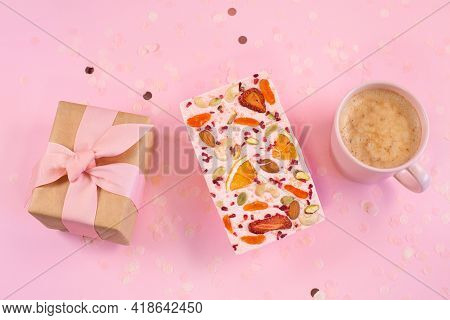 Cup Of Coffee And Handmade Pink Chocolate And Gift Box On A Fastive Pink Background