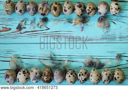 Quail Eggs On The Blue Wooden Background