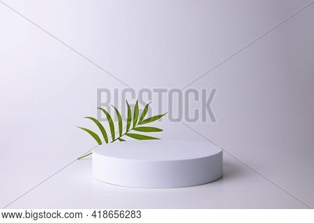 White Podium On The White Background With Tropical Leaf. Podium For Product, Cosmetic Presentation. 