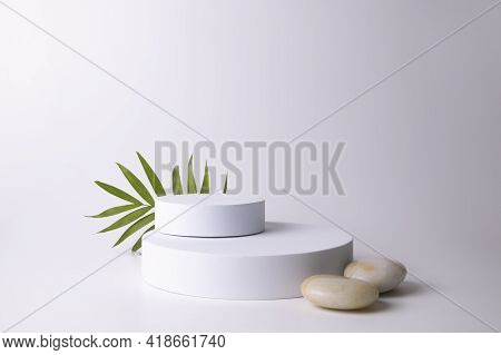 White Podium On The White Background With Tropical Leaf. Podium For Product, Cosmetic Presentation. 