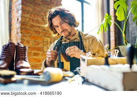 Hobby Became A Small Business Leather Man In Apron Is Making A Leather Wallet And Shooes In Studio