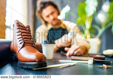 Hobby Became A Small Business Leather Man In Apron Is Making A Leather Wallet And Shooes In Studio