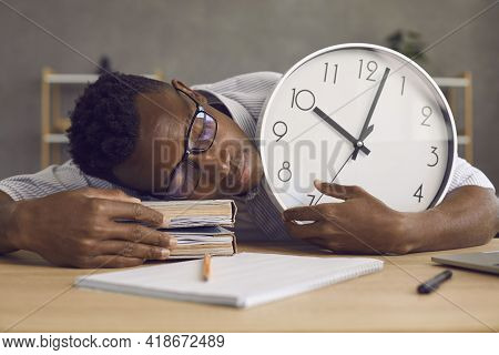 Tired Or Lazy Black Student Sleeping At His Desk Not Knowing Hes Late For Class