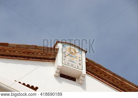 Sundial, Sun Light Clock On The Roof Of A House. Vintage, Earliest Type Of Timekeeping Device. Blue 