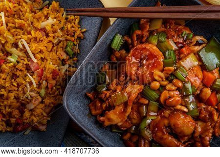 Takeout Chinese Kung Pao Chicken And Shrimp With Peanuts And Side Of Pork Fried Rice