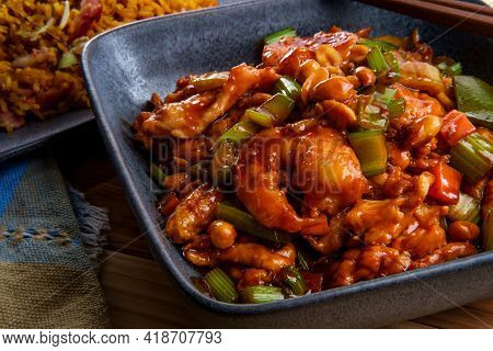 Takeout Chinese Kung Pao Chicken And Shrimp With Peanuts And Side Of Pork Fried Rice