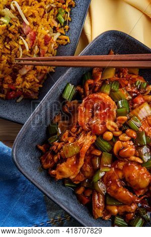 Takeout Chinese Kung Pao Chicken And Shrimp With Peanuts And Side Of Pork Fried Rice