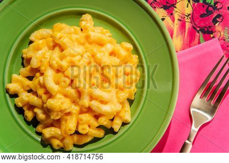 Stylized Pop Fashion Macaroni And Cheese On Abstract Pink Background