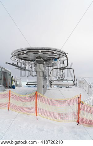 Kasprowy Wierch, Poland 28.01.2021- Ski Chair Lift Back View. Barriers In The Foreground. Snow-cover