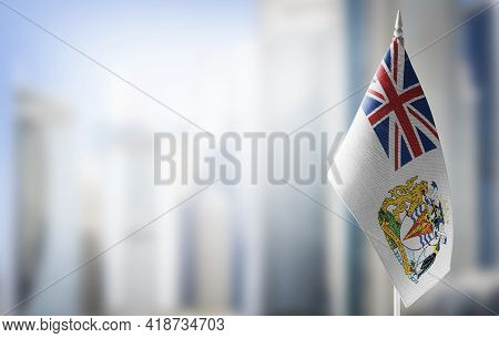 A Small Flag Of British Antarctic Territory On The Background Of A Blurred Background