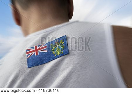 The National Flag Of Pitcairn Islands On The Athletes Back