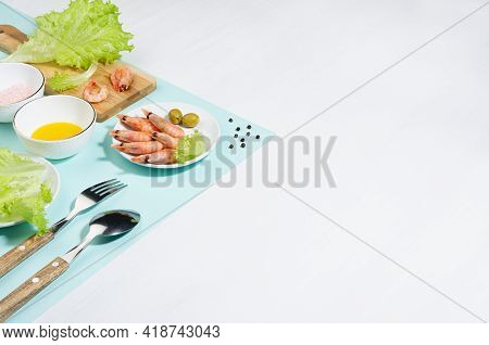 Recipe Of Organic Salad Of Green Salad, Shrimps, Spice And Oil On Minty Background, Copy Space. Mode