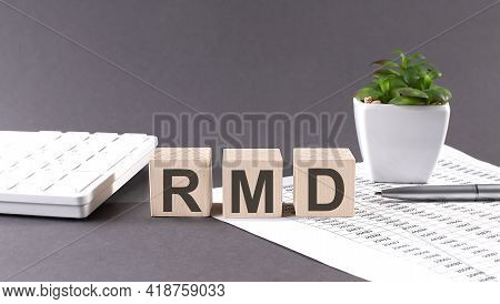 Concept Word Rmd On The Wooden Blocks On Gray Background From Green Flower And Chart.