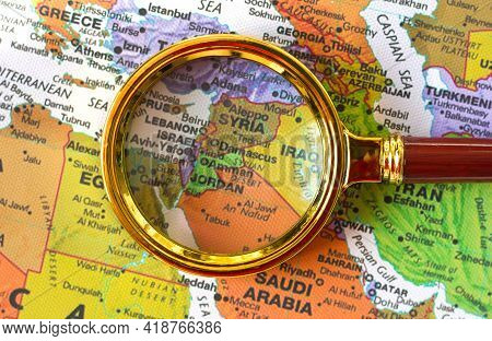 Lviv Ukraine-02 09 2021 :syria, Jordan, Israel, Lebanon A Map Of Asia In A Defocused Magnifying Glas