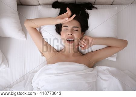 Young Woman Having Orgasm In Bed, Top View