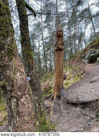 Wooden Sculpture of a fairy at the edge of the fairy path in Virton, Luxembourg, Belgium