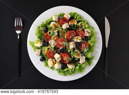 Healthy Salad Of Cherry Tomatoes, Cucumbers, Peppers, Black Olives, Quail Eggs And Gorgonzolla Chees
