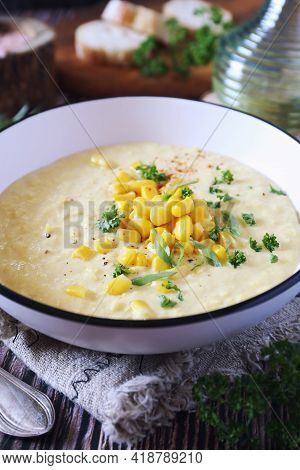 Corn Chowder. American Cuisine. Creamy Corn Soup, Green Onions And Parsley Dressing. Rustic Style