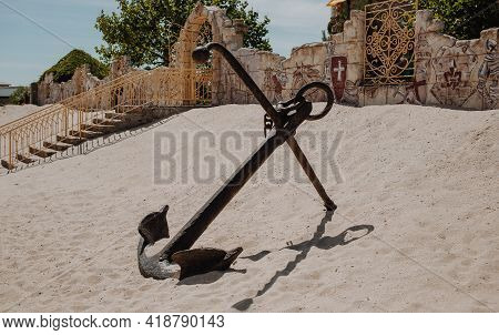 Berdyansk, Ukraine - 06.08.2020: Hige Metal Old Anchor Monument At The Sand Beach Of Ukrainian Azov 