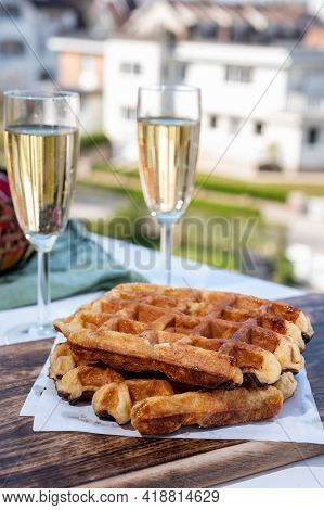 Breakfast With Fresh Baked Belgian Waffles And Brut Champagne Sparkling Wine In Flute Glasses Served