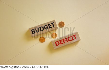 Budget Deficit Symbol. Concept Words 'budget Deficit' On Blocks On A Beautiful White Background, Met