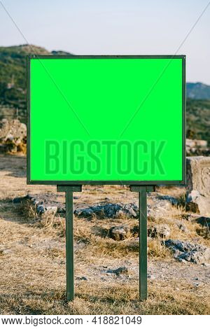 Rectangular Horizontal Empty Bigboard On The Roadside Against The Background Of Mountains