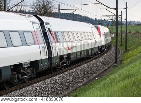 Switzerland, Niederbipp - 20. April 2021: Swiss Tilting Train Sbb Icn Rabde 500 Rounds A Curve At Sp