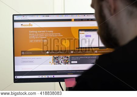 New York, Usa - 26 April 2021: Moodle Website Page On Screen, Man Using Service, Illustrative Editor
