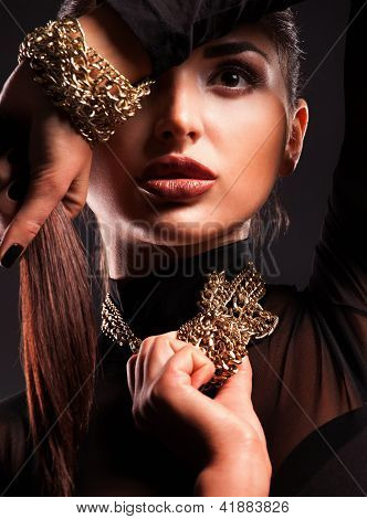 Young Beautiful Woman In A Necklace And Bracelet