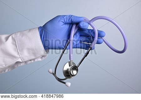 Doctor Hand Holds Medical Stethoscope. Standard Medical Gadget For Photostocks And Advertisement Fak