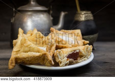 Plate Of Fried Quince And Sweet Potato Pastries With Mate.gastrnomia Argentina