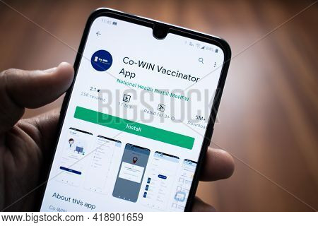 Maski, India 30,april 2021 : Close Up Of Hands Installing Co-win Vaccination Registration App On Mob