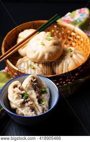 Food Concept Spot Focus Homemade Organic Dim Sum Baozi, Or Bao Pork Chinese Steamed Buns On Black Ba
