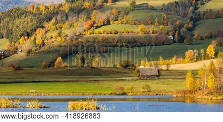 autumn pond under the mountains, Murau district,
Styria, Austria