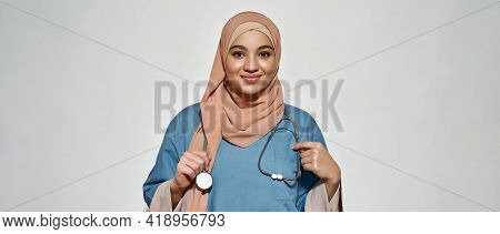Portrait Of Young Arabian Woman In Doctor Outfit With Stethoscope Smiling At Camera While Posing On 