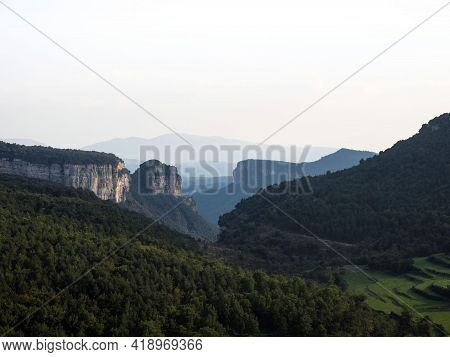 Panorama View Of Stone Rock Cliff Gorge Canyon With Green Grass Meadow Fields Near Tavertet Osona Ba