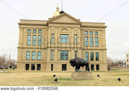 April 26, 2021 In Cheyenne, Wy:  Buffalo Art Sculpture On The Courtyard Besides The Wyoming State Ca