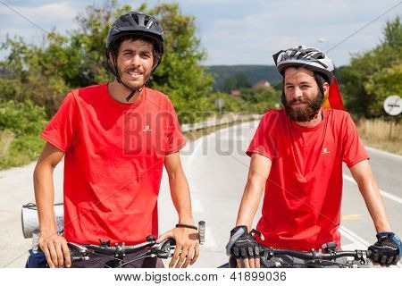 MOSTAR, BOSNIA - AUGUST 14: Young cyclist touring from Madrid to Istanbul on August 14, 2012 near Mostar, Bosnia. A growing number of eco-travellers tour by bike to lessen their carbon footprint.