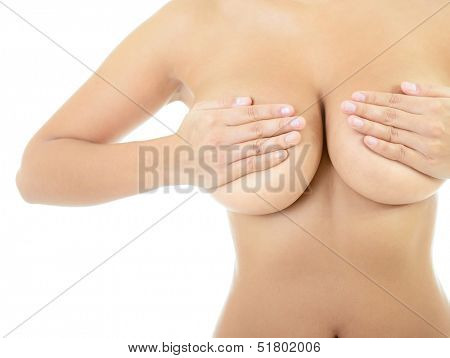Body of beautiful woman covering her breast, over white
