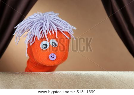 Puppet show on brown background