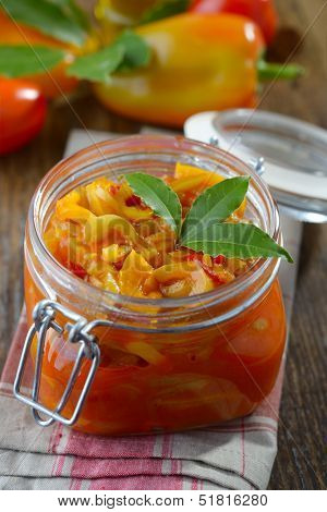 Lecso in a jar on a rustic table