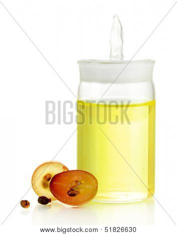 Ripe sliced grape and grapeseed oil, isolated on white