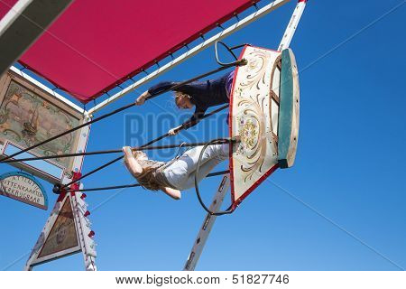 Nieuwehorne, The Netherlands - Sep 28: Fair With Two Unknown Girls At A Wooden Swing During The Agri